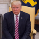Donald Trump, who would rather be posting. Photo: Getty / Pool